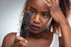 Hair Loss Treatment NYC - Shocked Woman Suffering From Hair Loss Problem